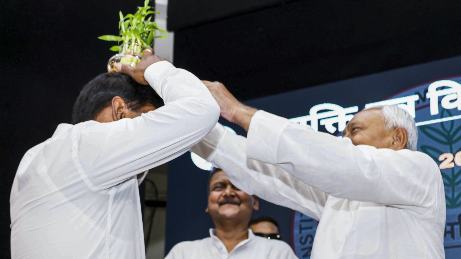 Nitish Kumar places plant on senior officer's head during event, RJD questions his ‘mental state’