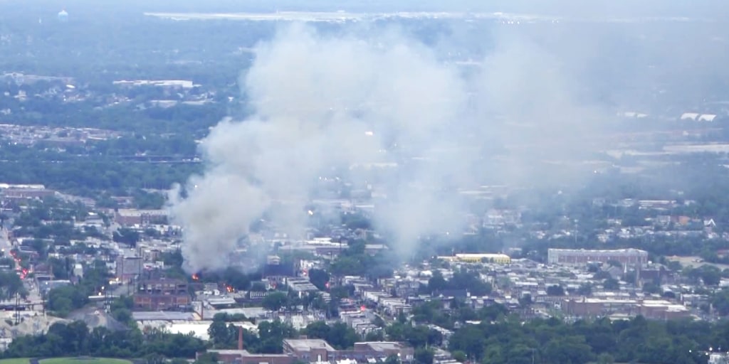 Fire burns out of control at vacant mattress warehouse in Baltimore