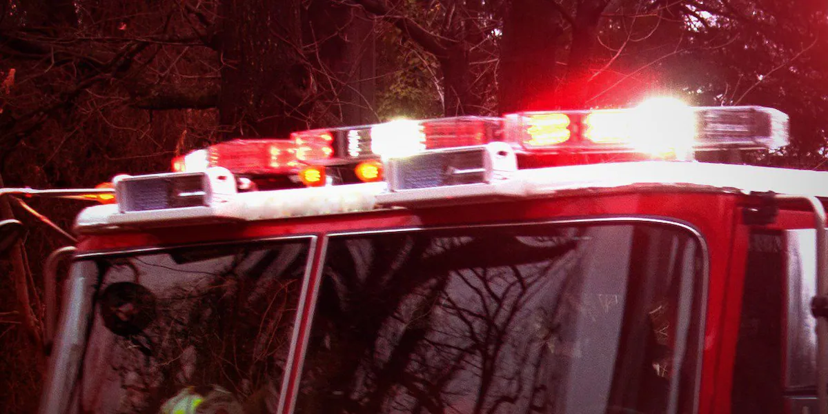 Firefighters work to put out several vehicles on fire at Newington business