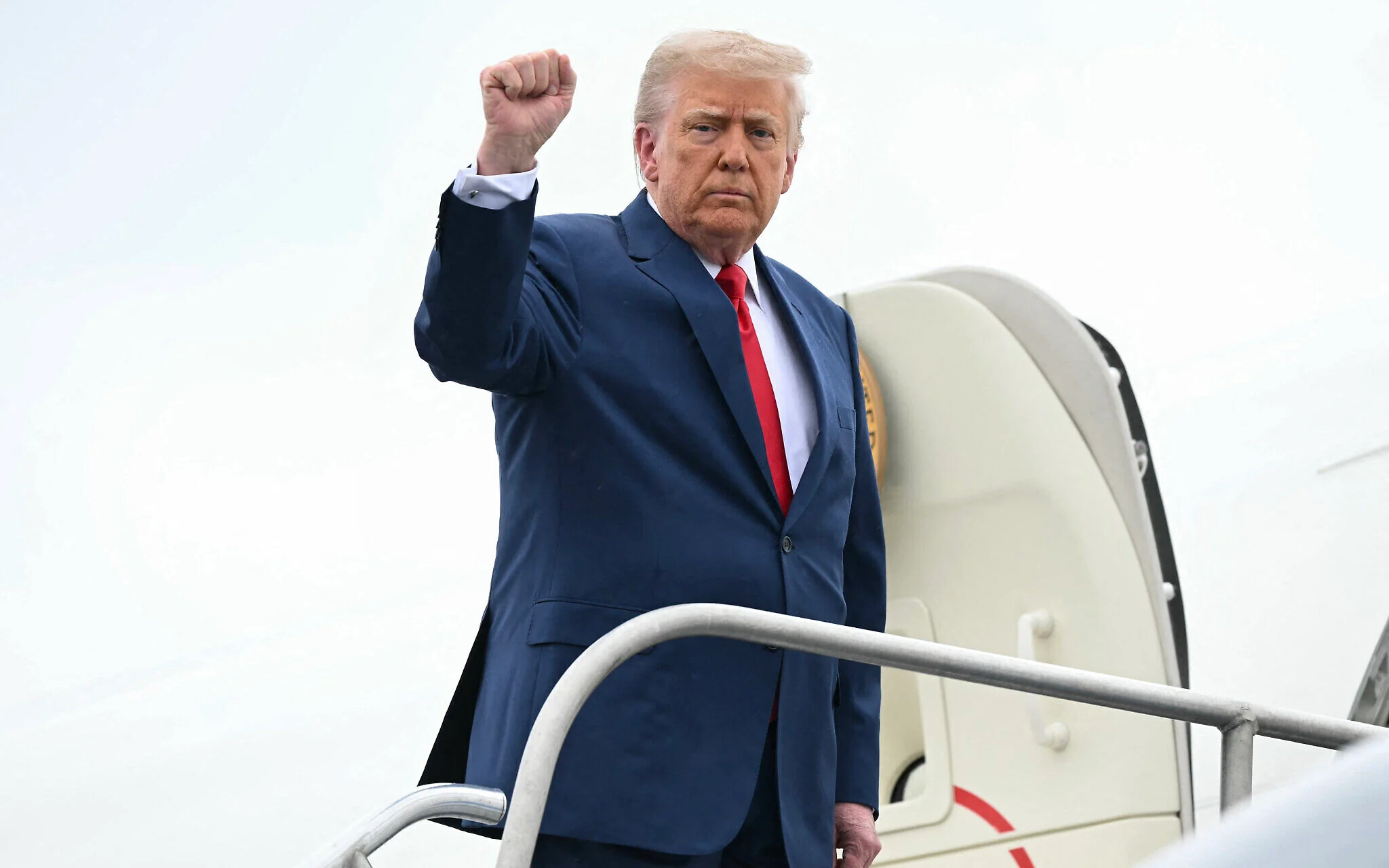 Trump travel ban comes into effect, with citizens from 12 nations barred from US