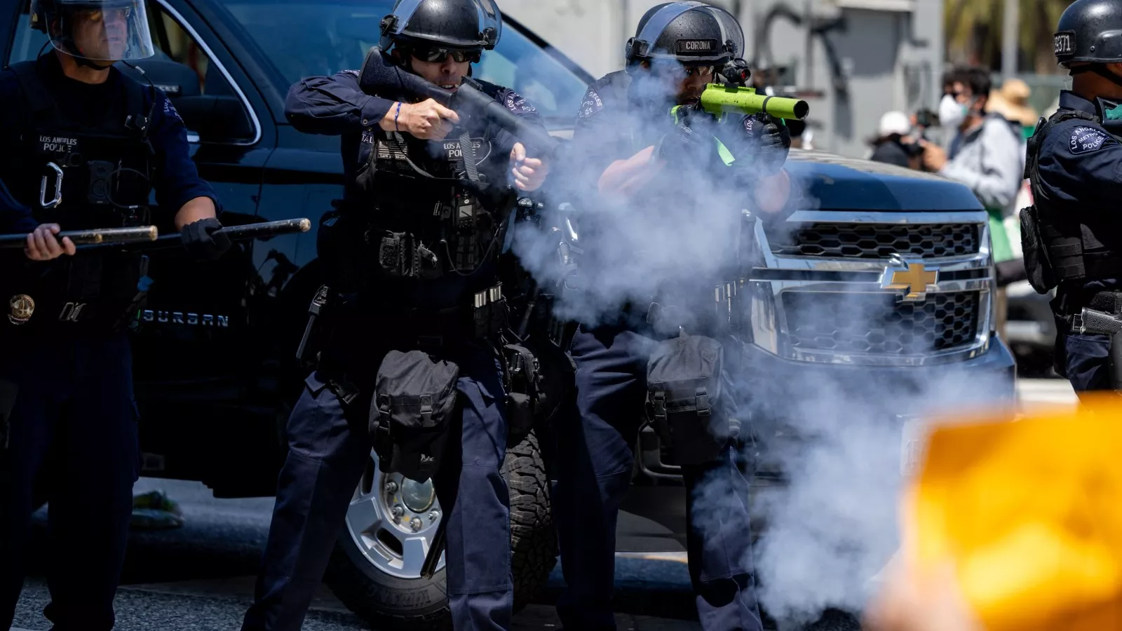 LA riot police shoot protester in the head with rubber bullet