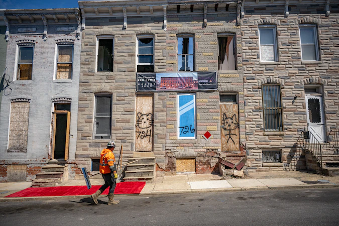 Banks pledge to raise at least $100 million to address Baltimore’s vacant homes