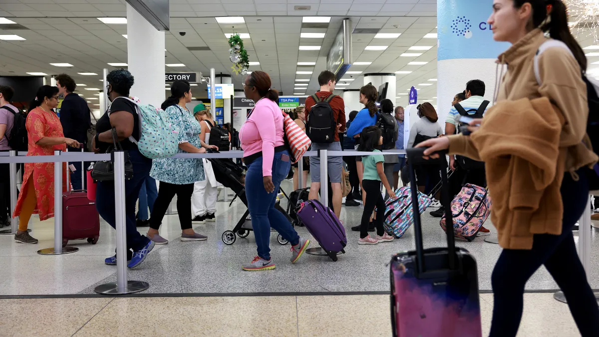 Some visitors report extra scrutiny at US airports as Trump's new travel ban begins