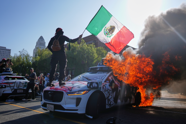 Photos: Protesters confront federal agents, set fires in downtown L.A.