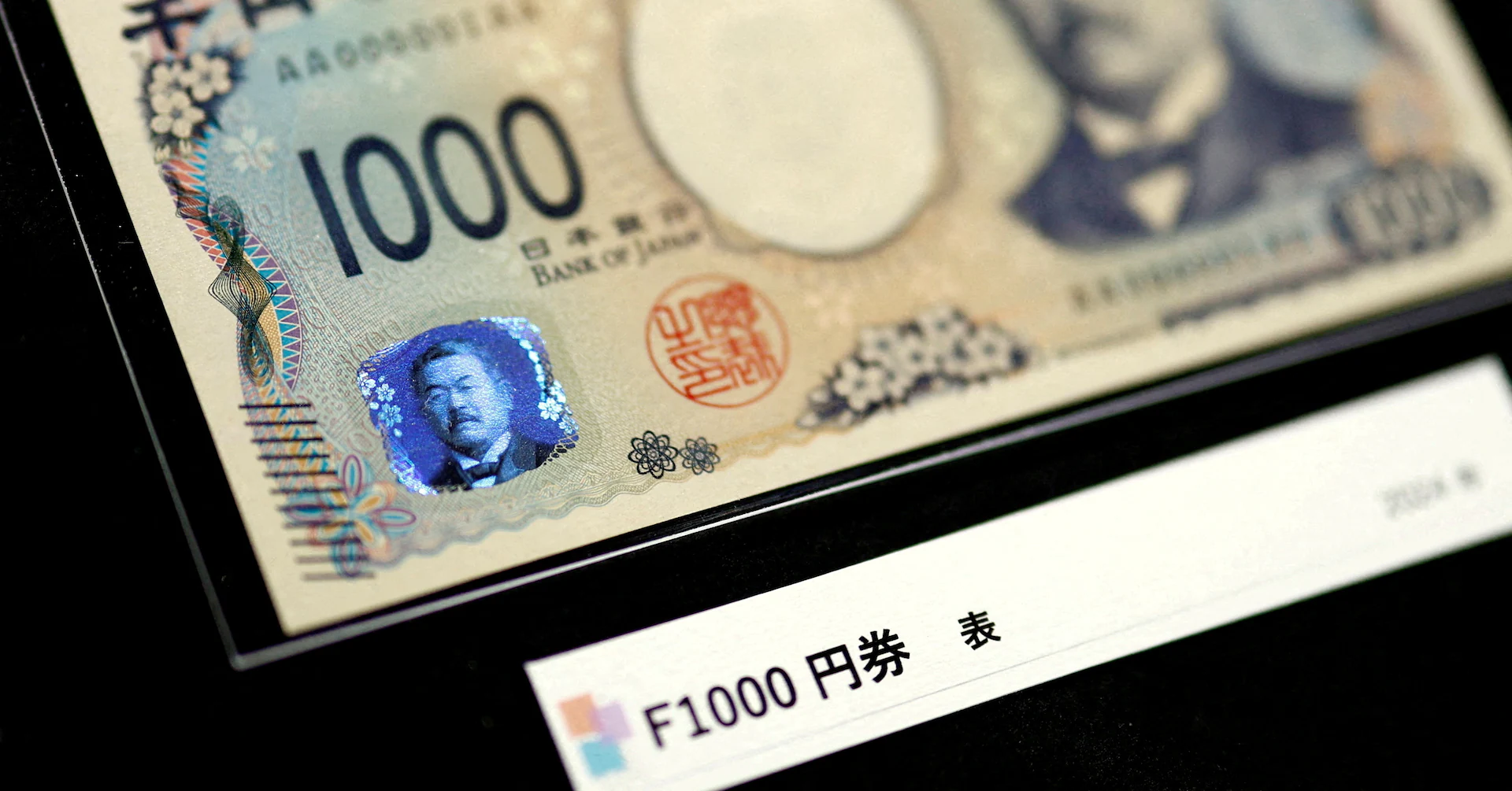 Japan's yen sinks as spike in crude oil overpowers safe-haven appeal