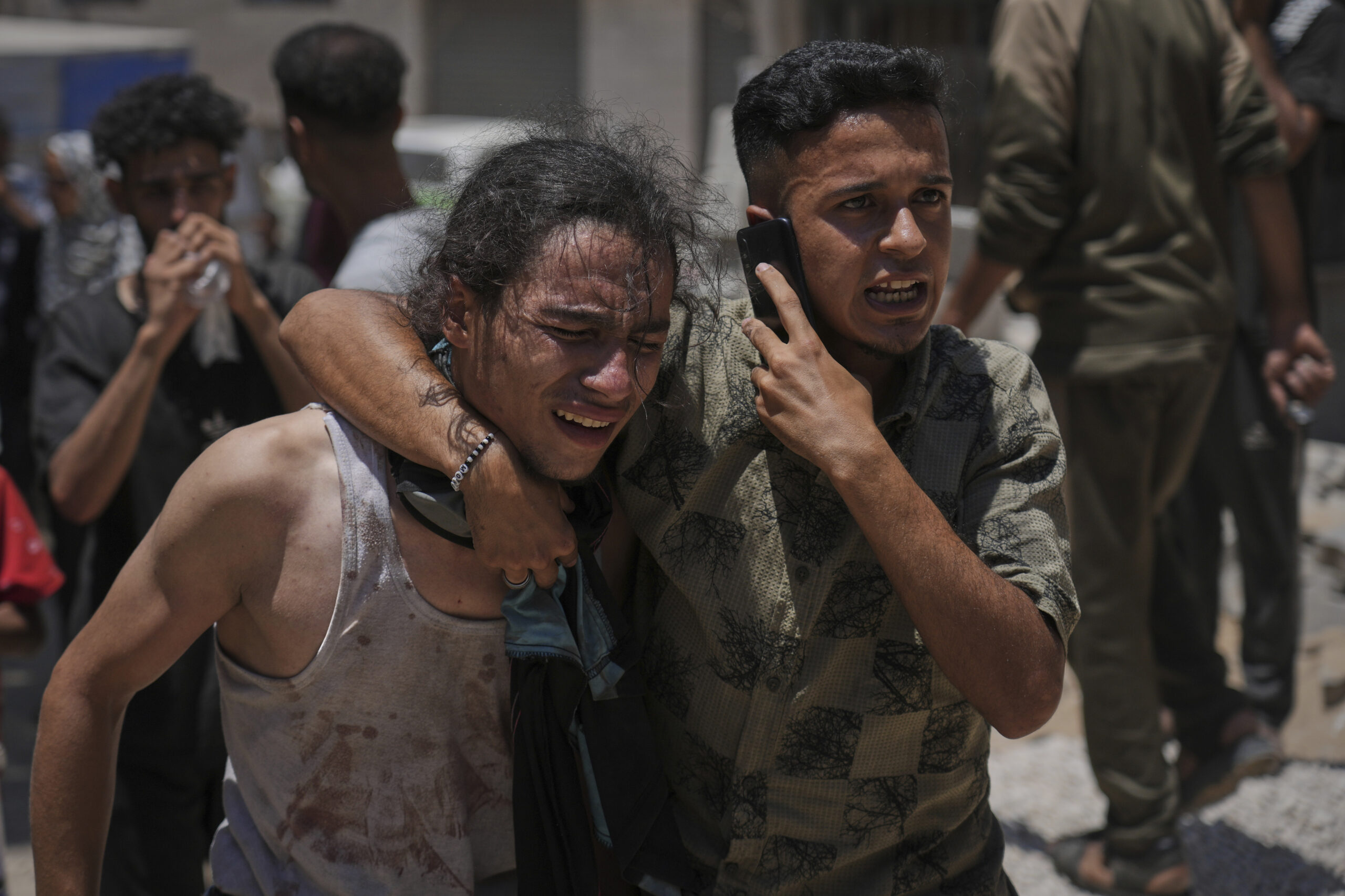 Dozens of Palestinians killed while waiting for humanitarian aid across Gaza, health ministry says