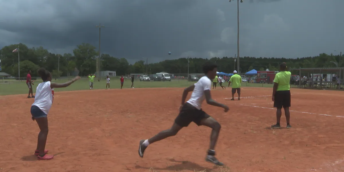 Locals play kickball in Newton to support mental health awareness