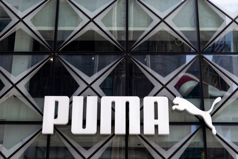Puma shares dive after warning of full year loss