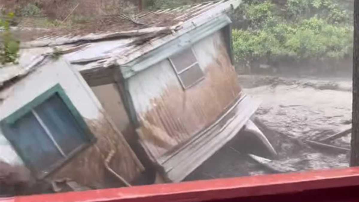 Video shows home being swept away by floodwaters
