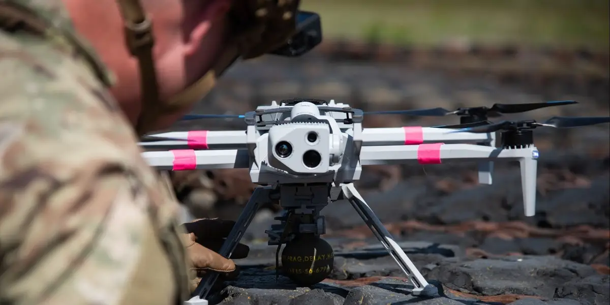Video captures the US Army's first-ever test of grenade-dropping drones. They bombed vehicle targets.