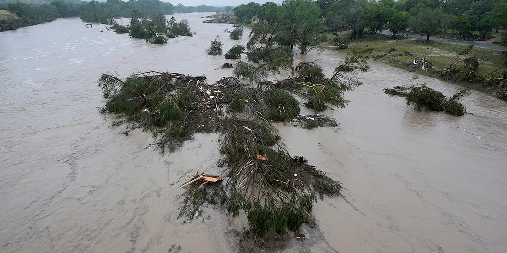 Texas family helps rescue woman clinging to tree after being swept 20 miles downriver