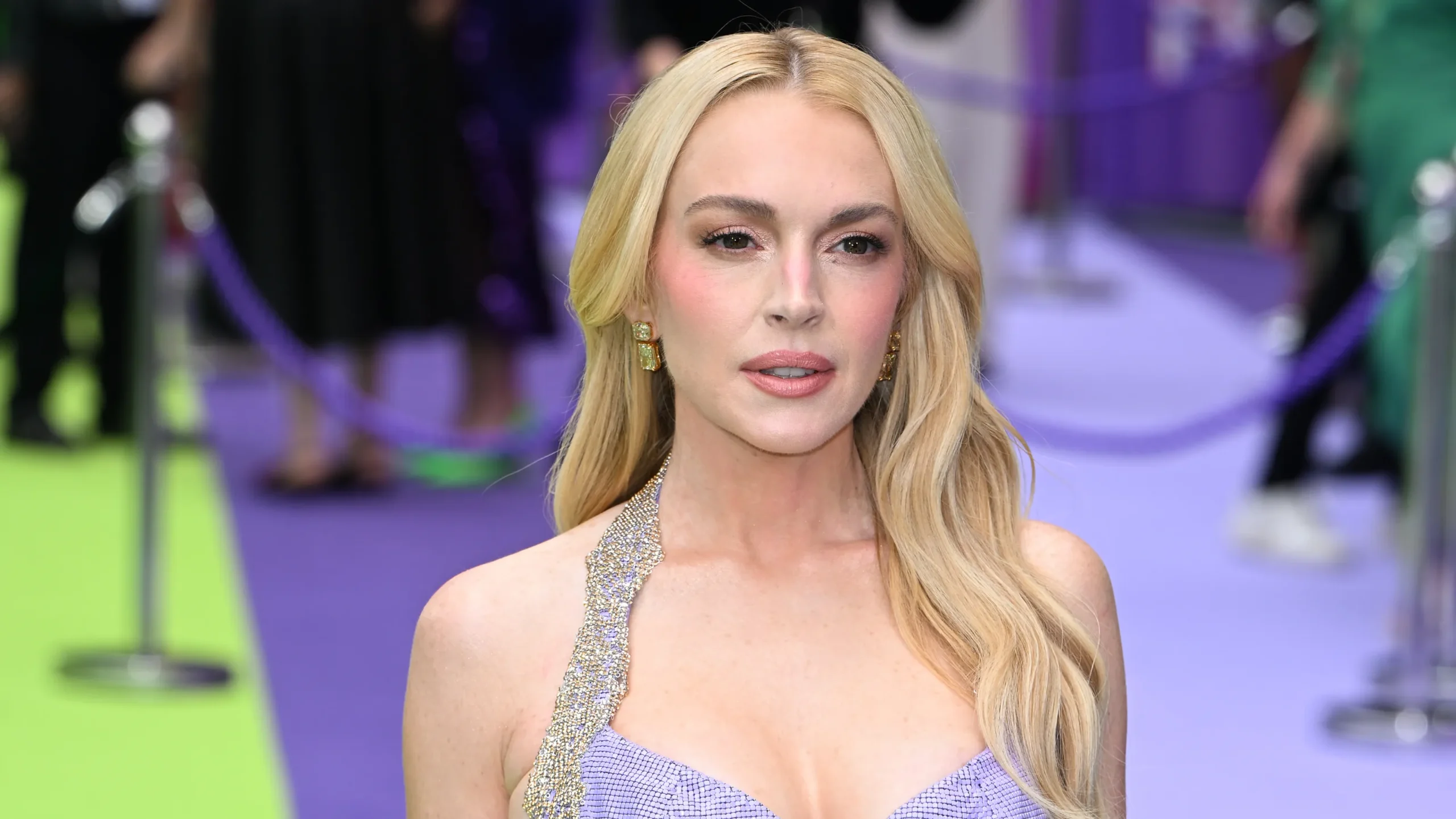 Lindsay Lohan channels 'Freaky Friday,' 'Parent Trap' roles with press tour looks: Photos